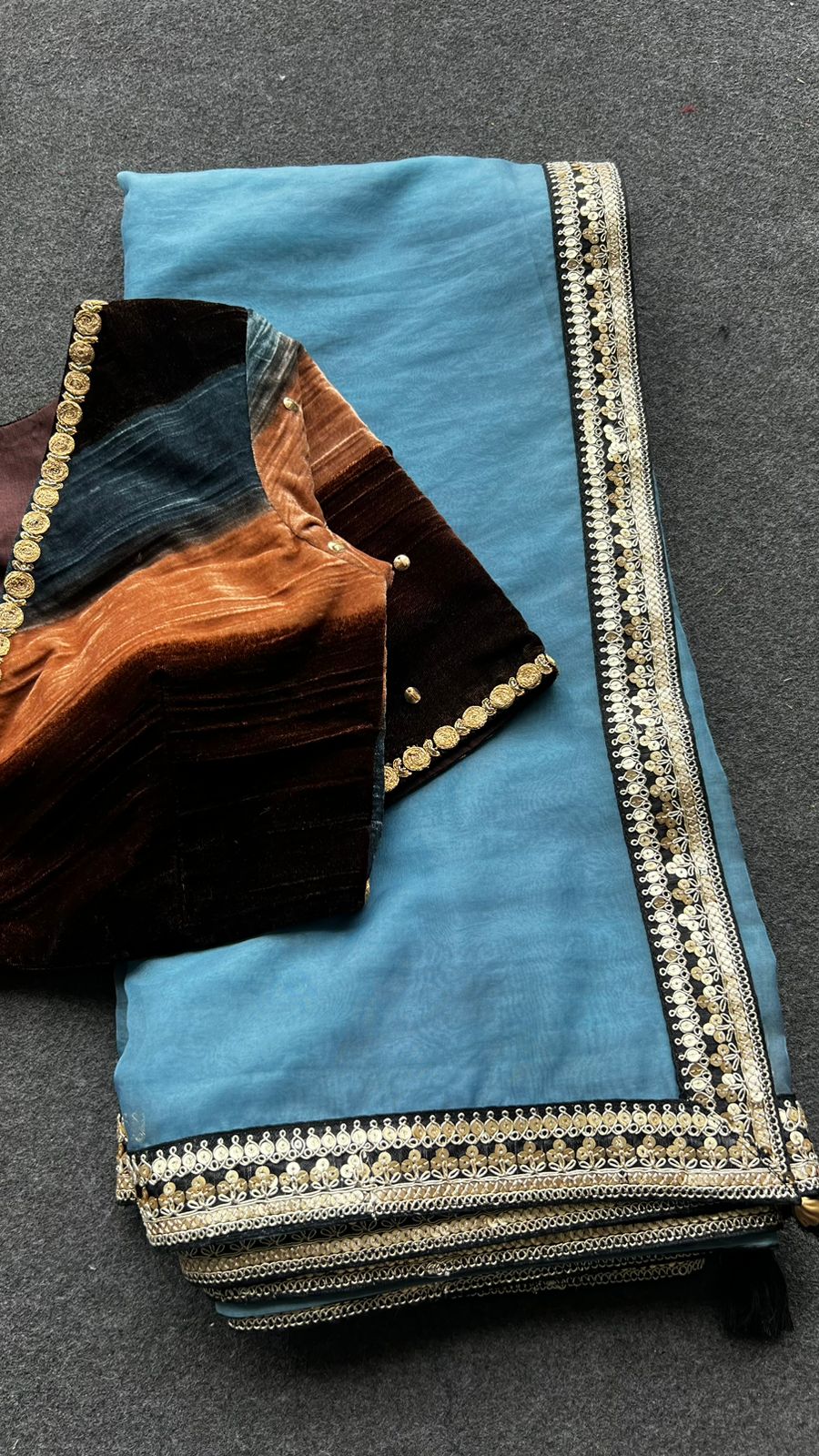 Blue organza saree with stripe velvet blouse