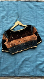 Blue organza saree with stripe velvet blouse