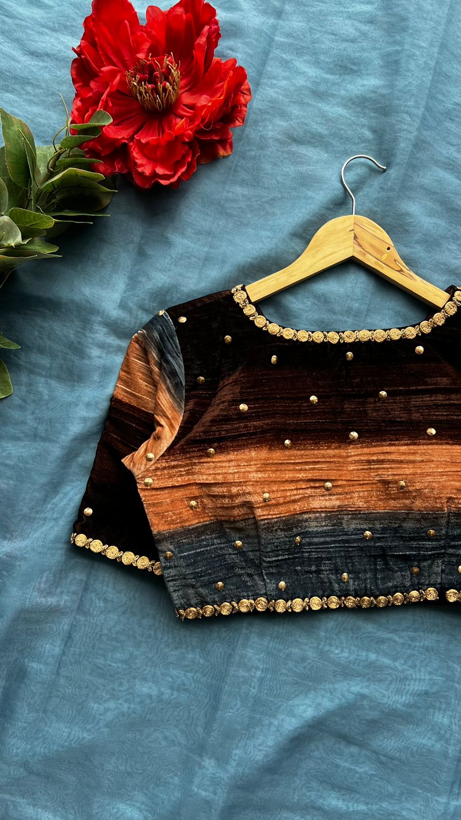 Blue organza saree with stripe velvet blouse