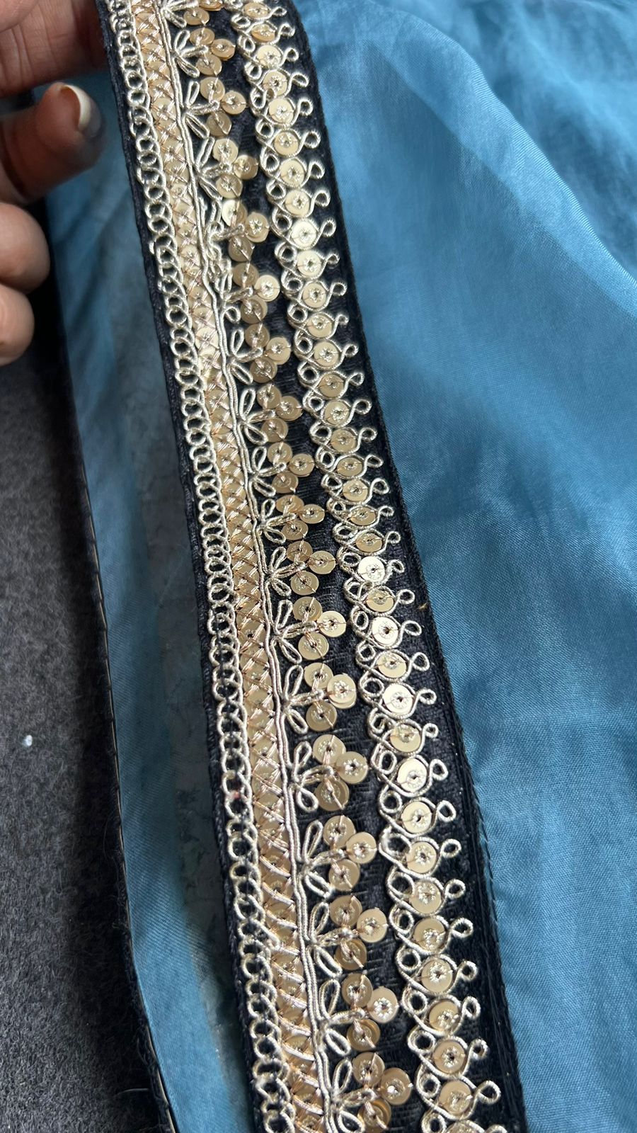 Blue organza saree with stripe velvet blouse