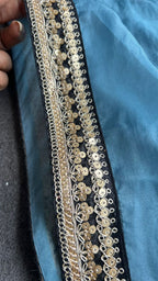 Blue organza saree with stripe velvet blouse