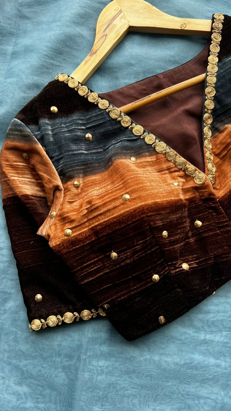 Blue organza saree with stripe velvet blouse