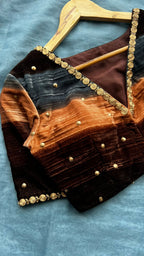 Blue organza saree with stripe velvet blouse