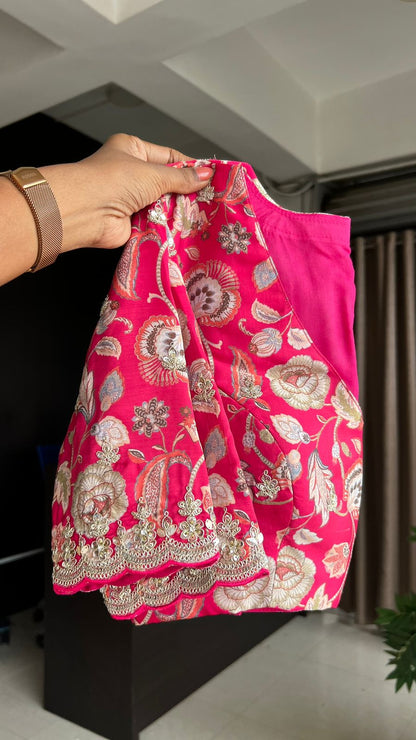 Green soft tissue saree with pink floral embroidered blouse