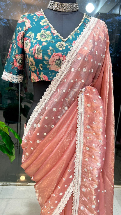 Peach soft glass tissue saree with green floral embroidery blouse