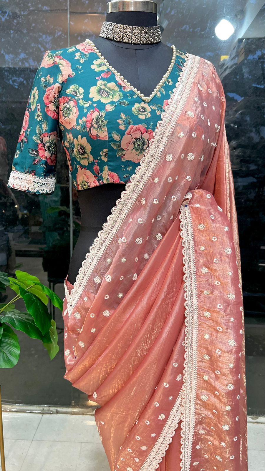 Peach soft glass tissue saree with green floral embroidery blouse