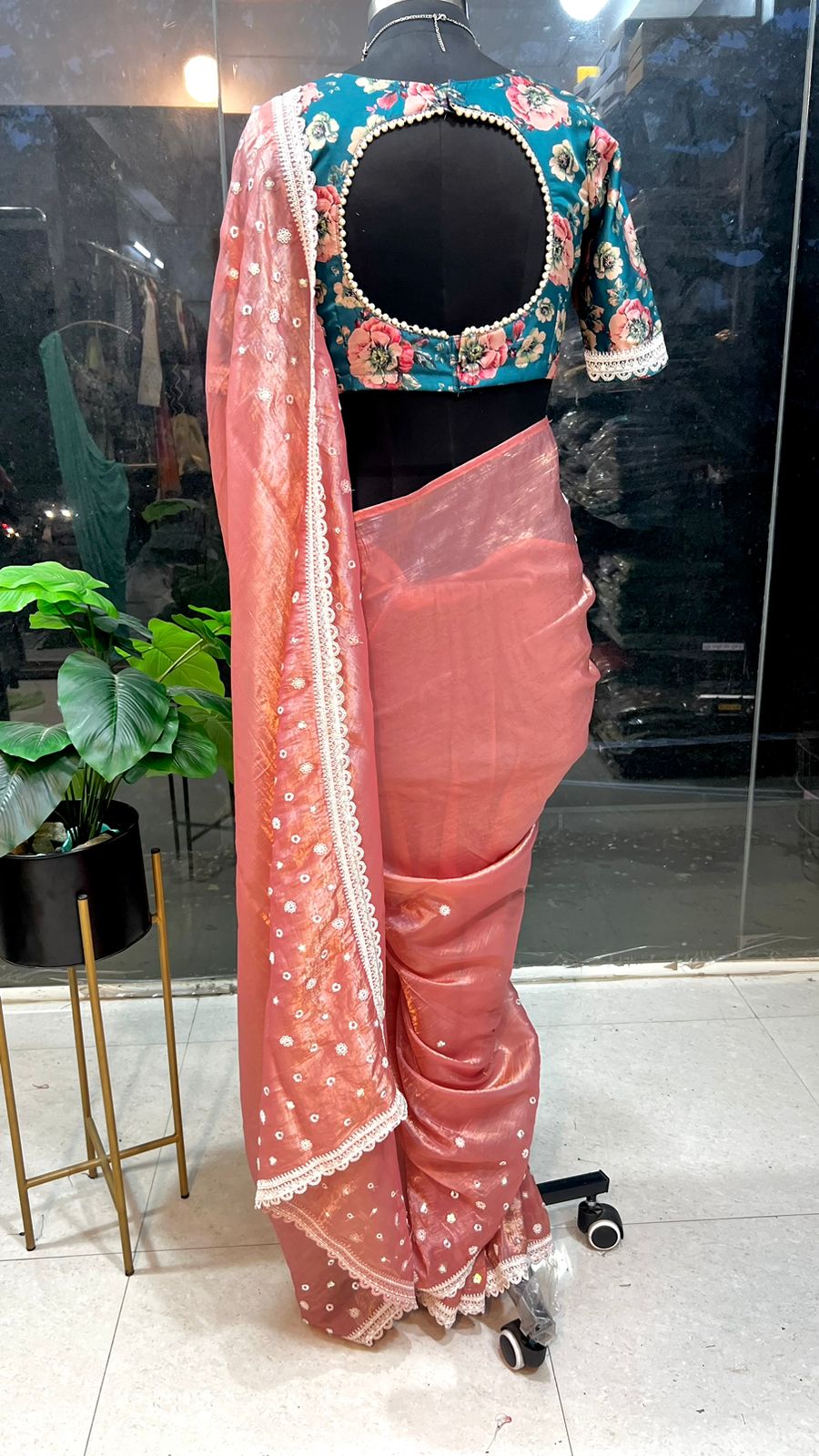 Peach soft glass tissue saree with green floral embroidery blouse