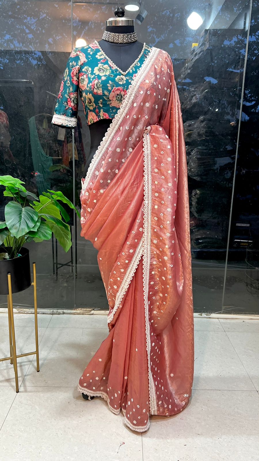 Peach soft glass tissue saree with green floral embroidery blouse