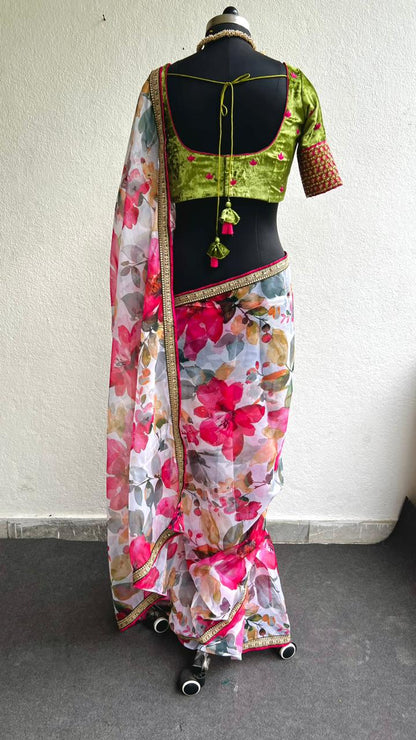 Pink floral organza saree with green velvet embroidered blouse