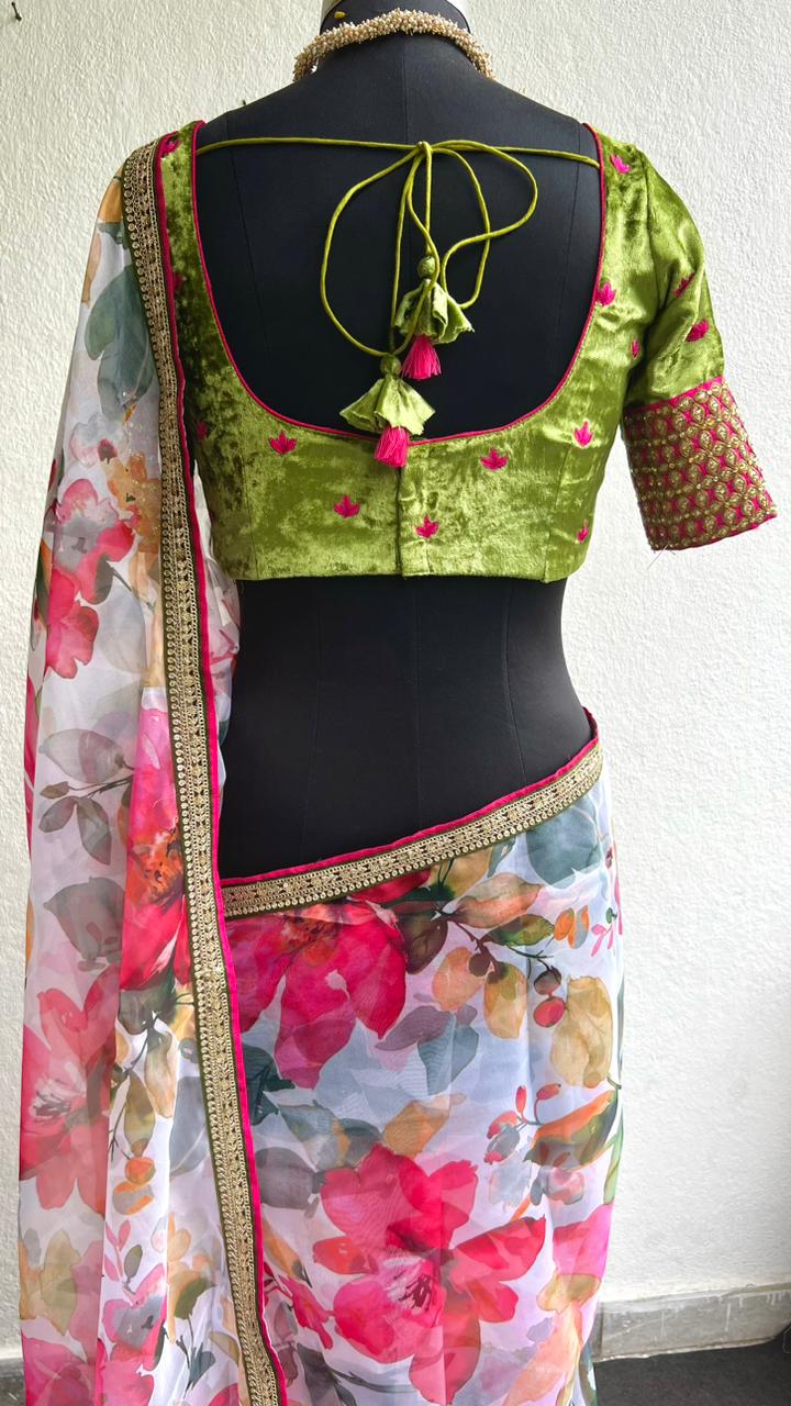 Pink floral organza saree with green velvet embroidered blouse