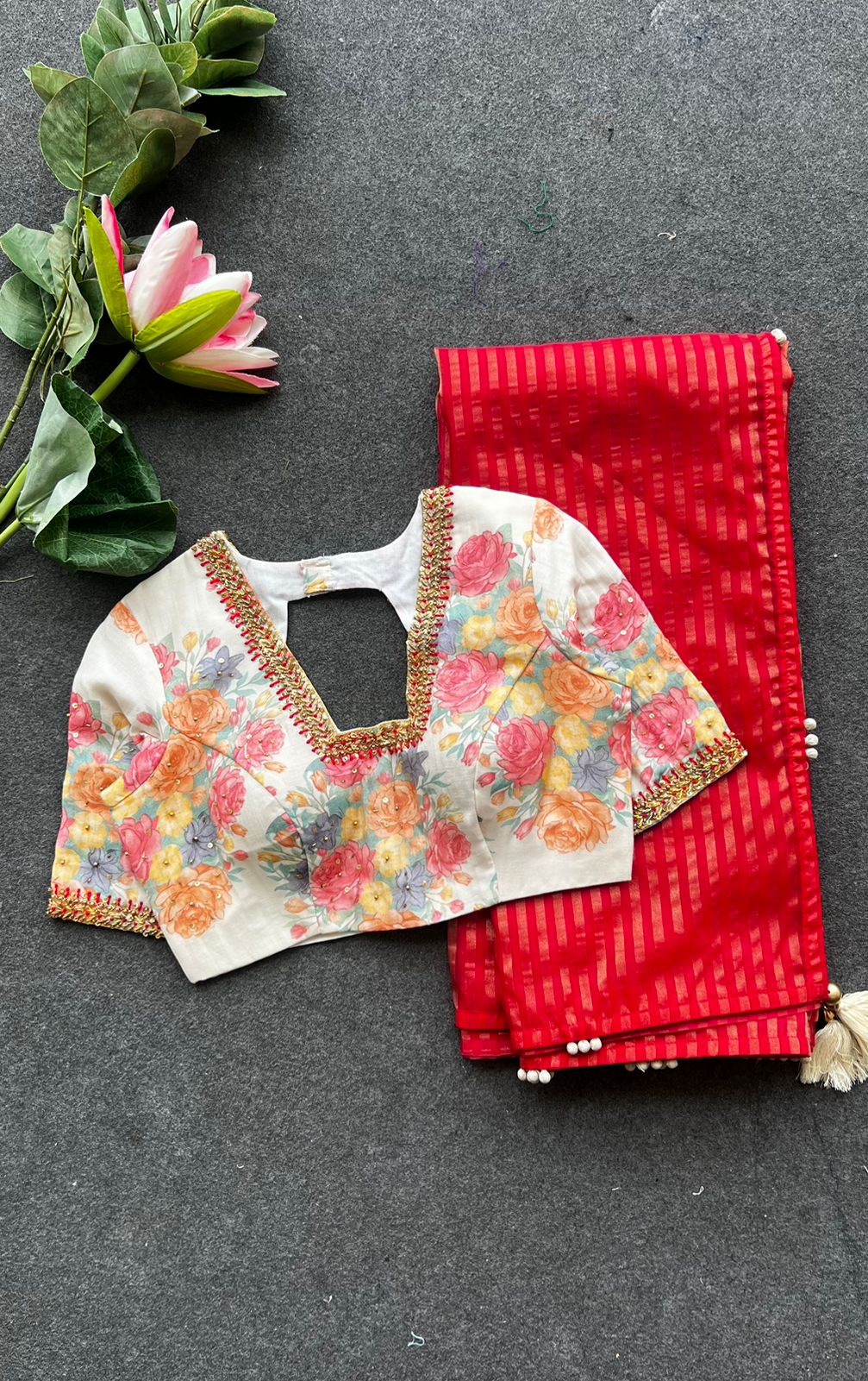 Red stripped tissue saree with white floral hand work blouse