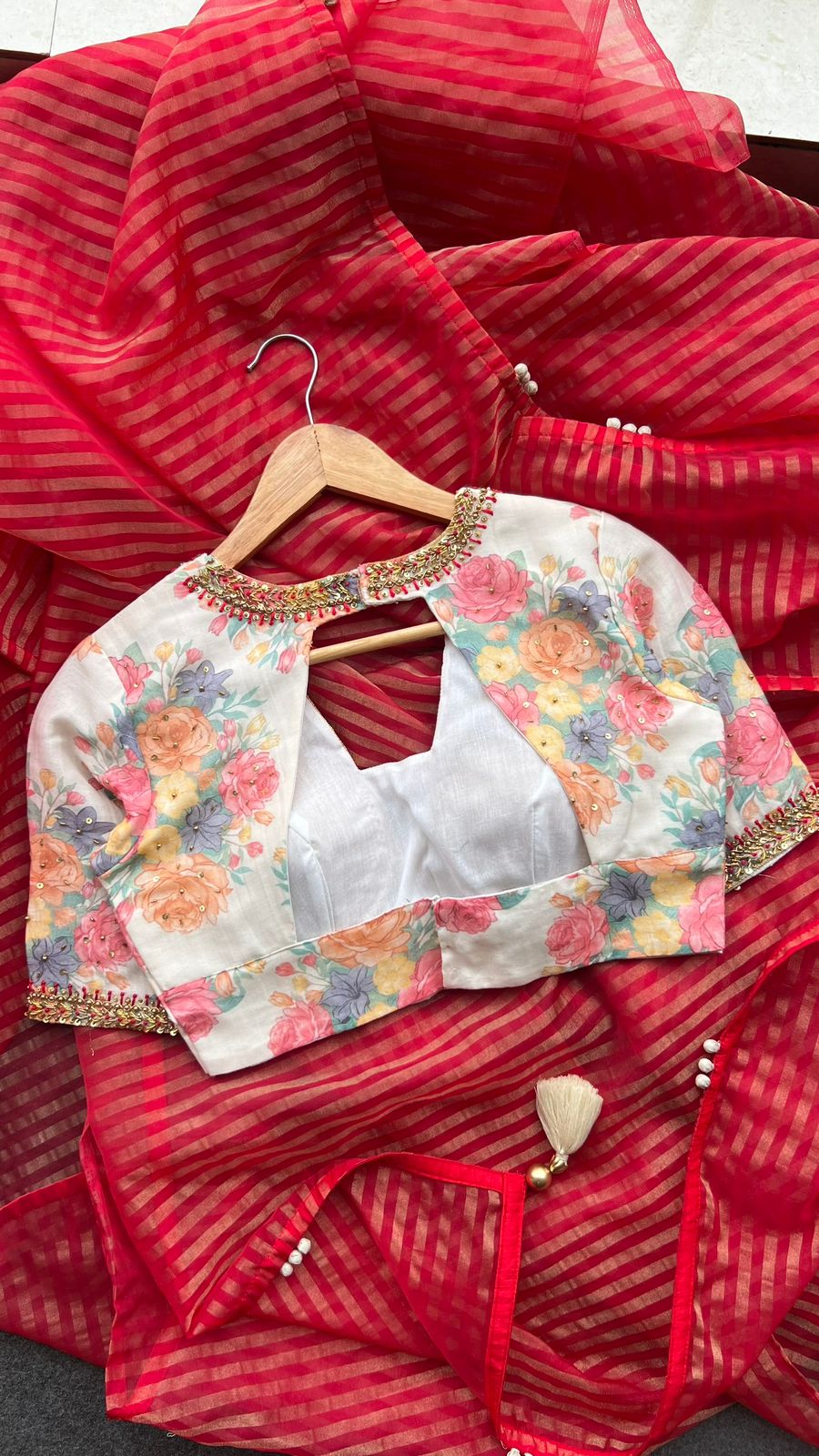 Red stripped tissue saree with white floral hand work blouse