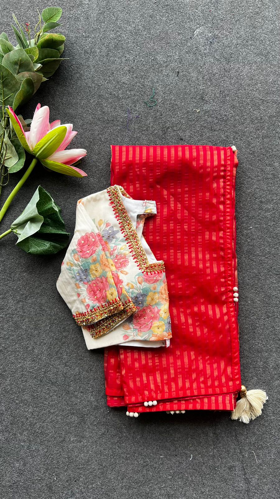 Red stripped tissue saree with white floral hand work blouse