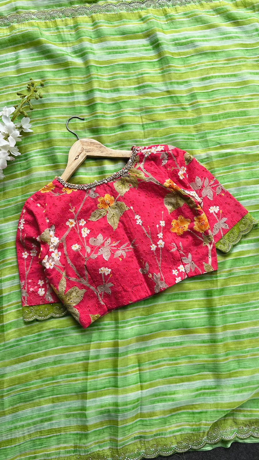 Green chiffon saree with red floral hand work blouse