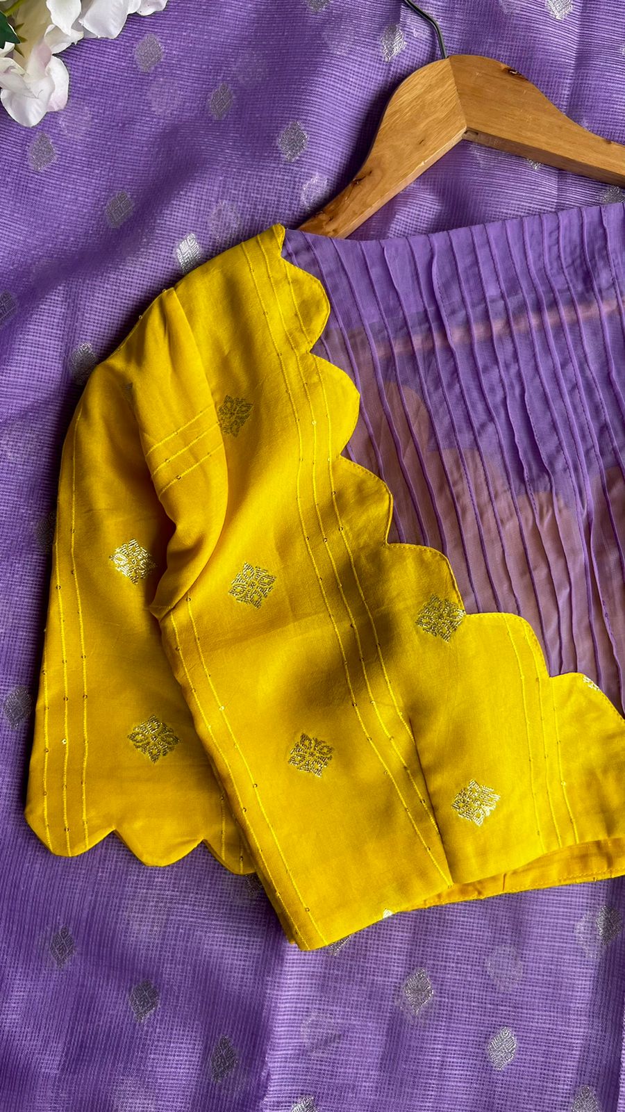 Purple kota embroidery saree with yellow blouse