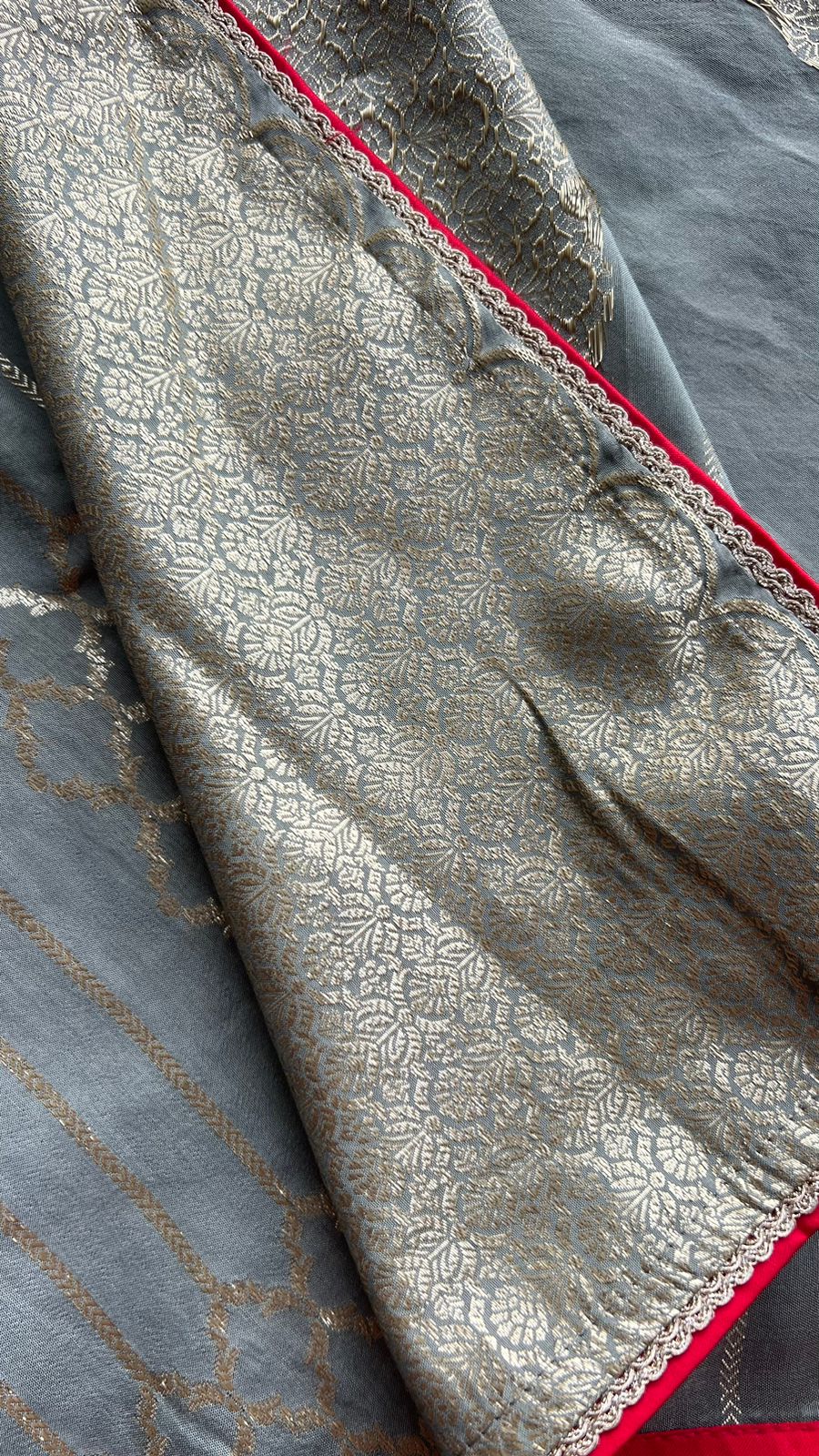 Grey silk saree with red heavy embroidery work blouse