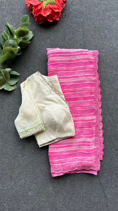 Pink chiffon stripped saree with cream hand work blouse