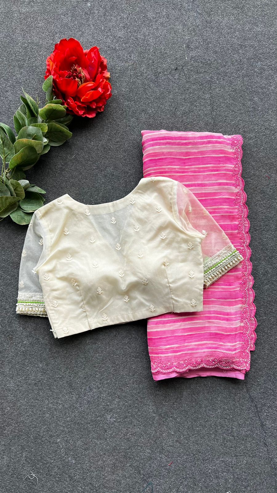 Pink chiffon stripped saree with cream hand work blouse