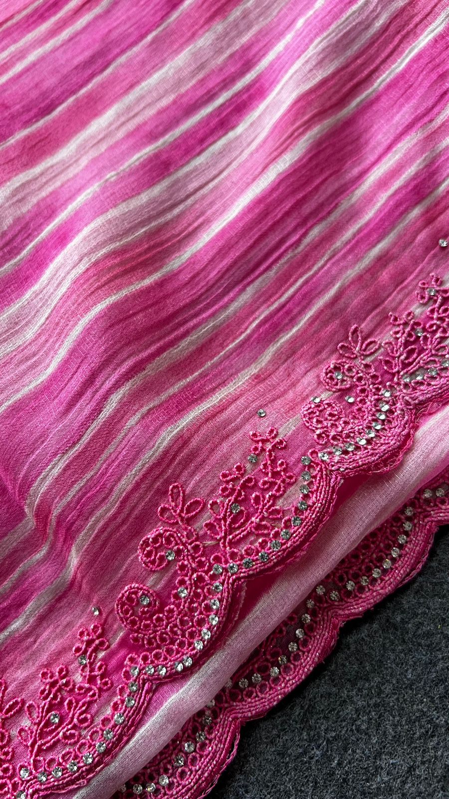 Pink chiffon stripped saree with cream hand work blouse