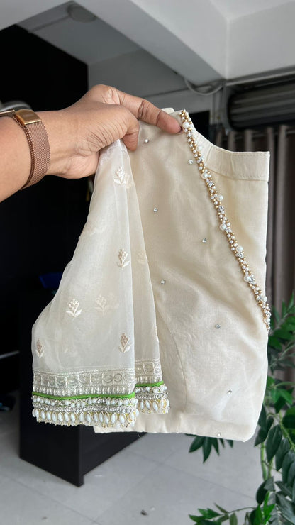 Pink chiffon stripped saree with cream hand work blouse