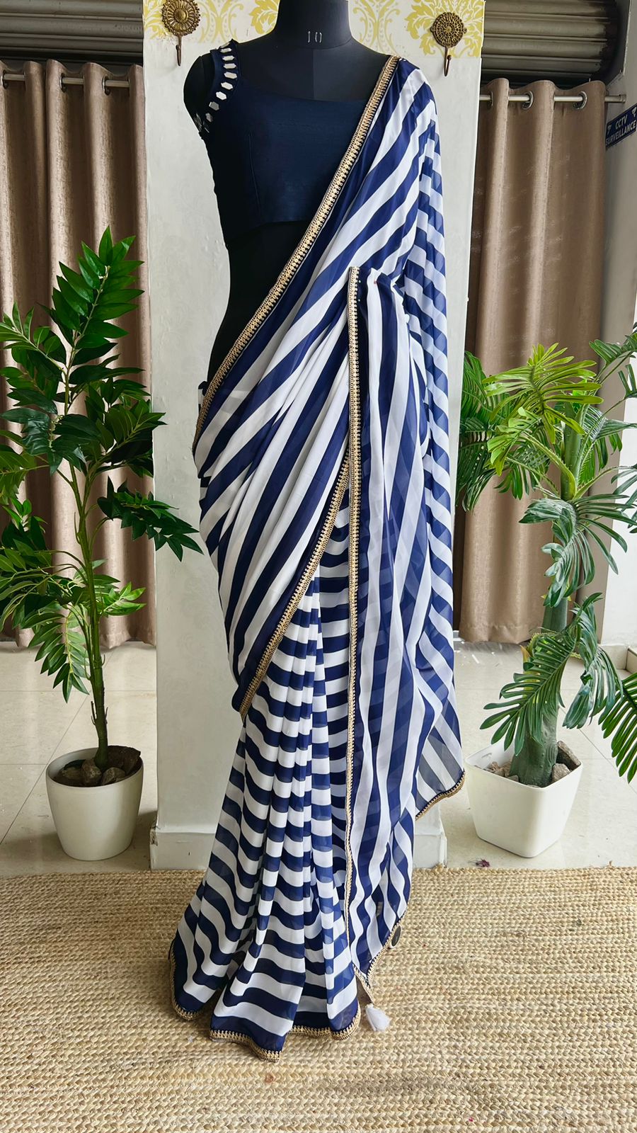 White & blue stripped georgette saree with blue original mirror work blouse