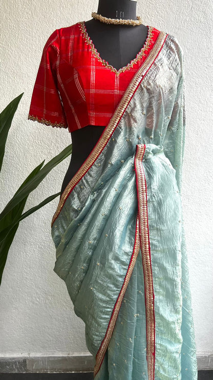 Blue glass tissue saree with red tussar silk hand work blouse