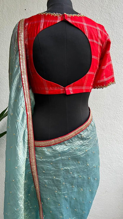 Blue glass tissue saree with red tussar silk hand work blouse