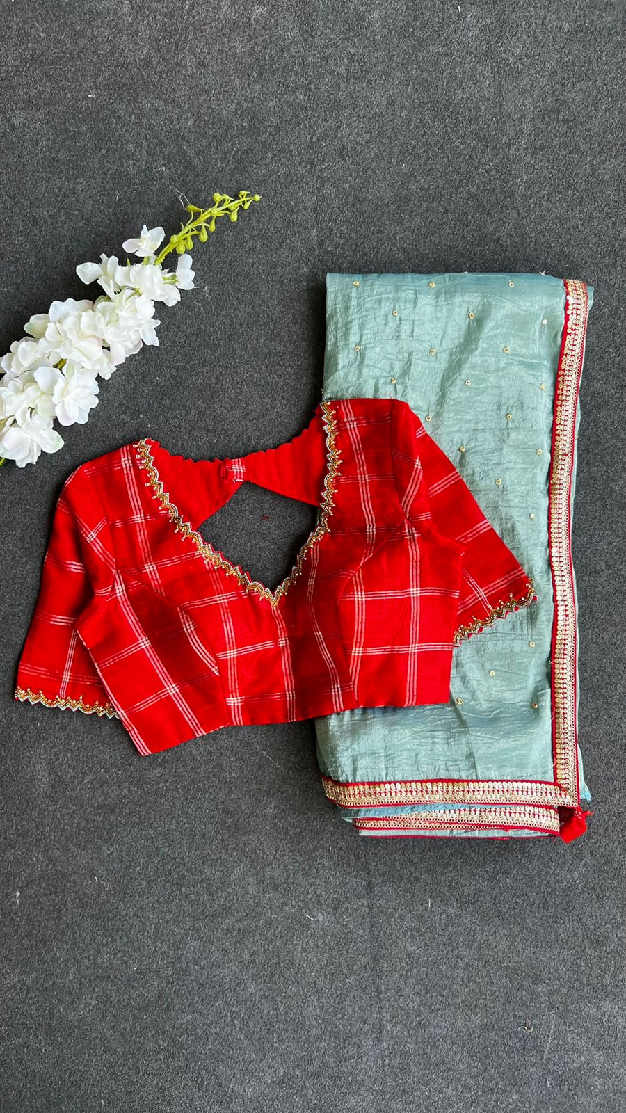 Blue glass tissue saree with red tussar silk hand work blouse