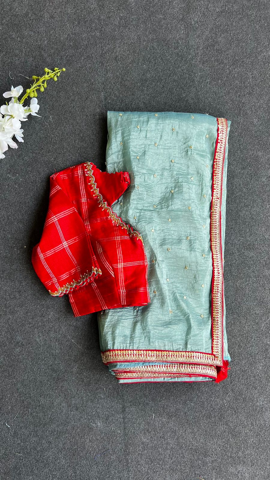 Blue glass tissue saree with red tussar silk hand work blouse