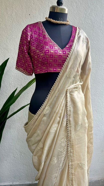 Cream soft jute saree with pink banarasi hand work blouse