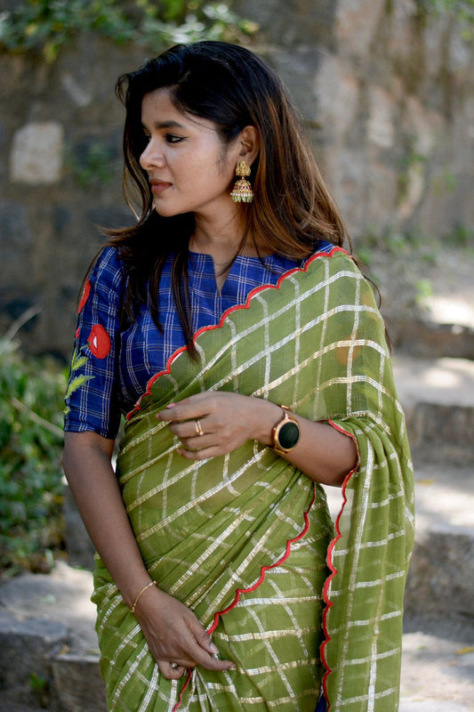 Green checked chiffon saree with blue silk hand work blouse