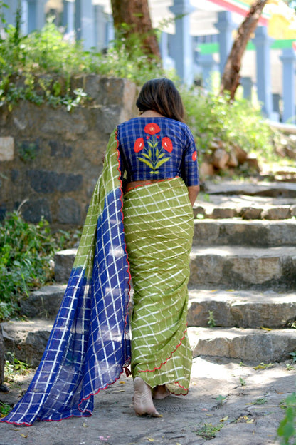 Green checked chiffon saree with blue silk hand work blouse