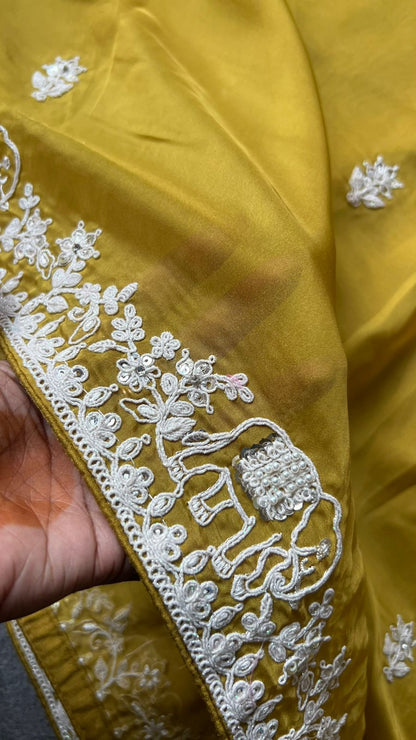 Fenugreek yellow soft organza saree with pink floral embroidery blouse