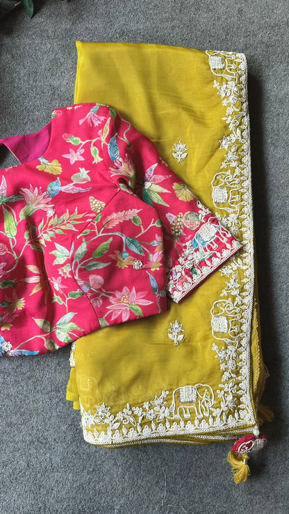 Fenugreek yellow soft organza saree with pink floral embroidery blouse