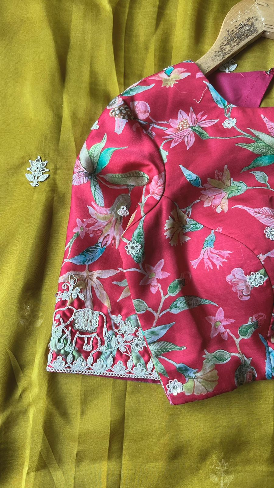 Fenugreek yellow soft organza saree with pink floral embroidery blouse