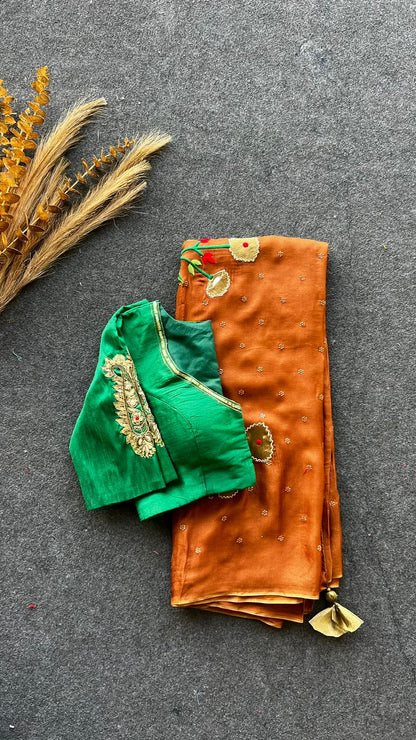 Honey jute saree with green hand worked paisley blouse