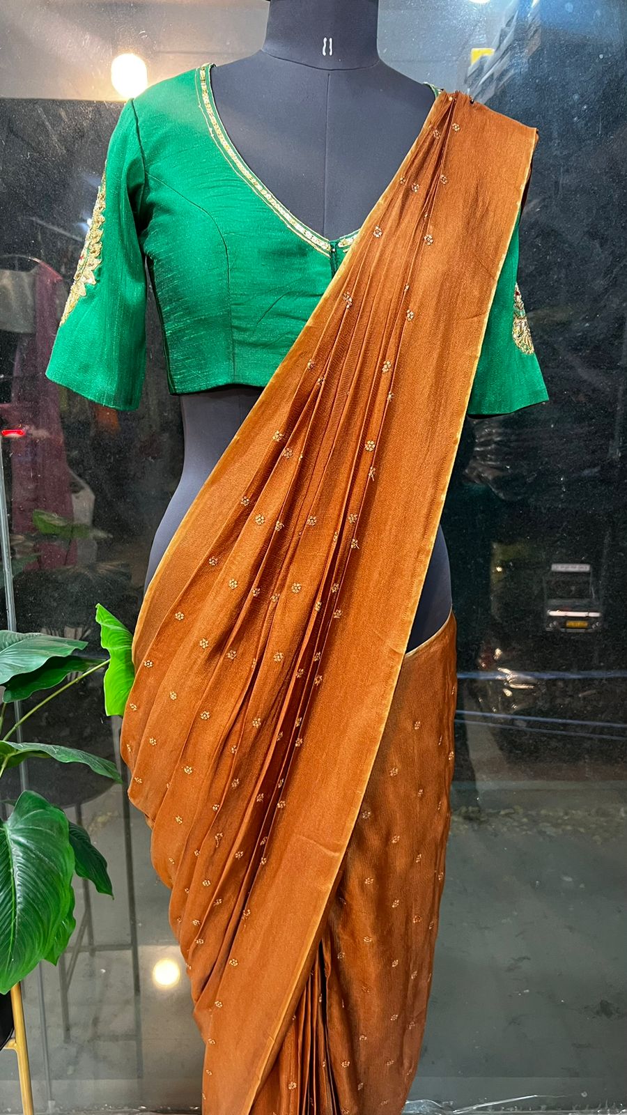 Honey jute saree with green hand worked paisley blouse