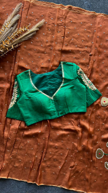 Honey jute saree with green hand worked paisley blouse