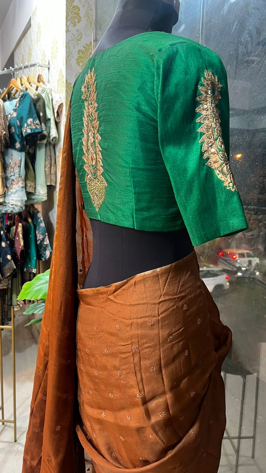 Honey jute saree with green hand worked paisley blouse