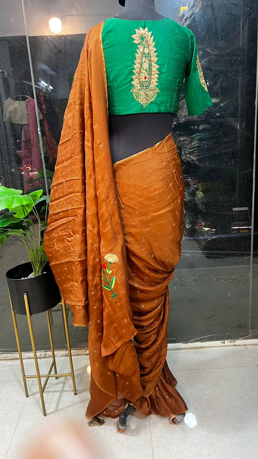 Honey jute saree with green hand worked paisley blouse