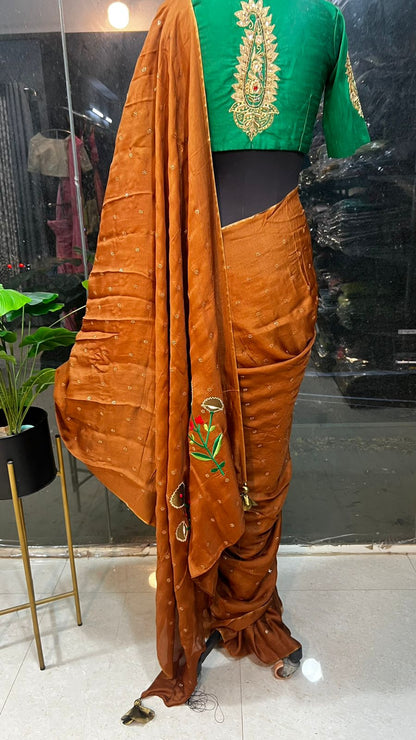 Honey jute saree with green hand worked paisley blouse