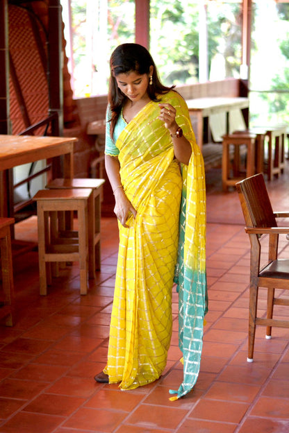 Yellow chiffon saree with green pure jute hand worked blouse