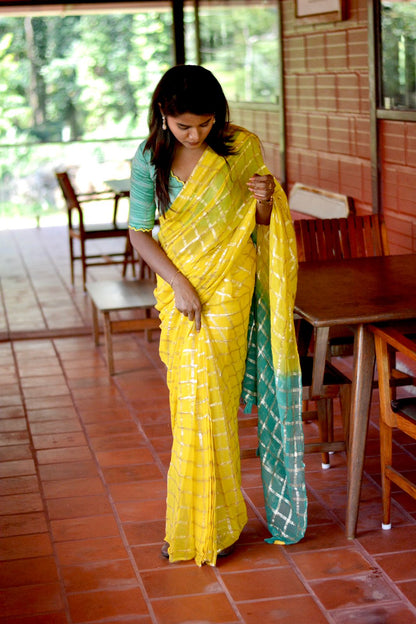 Yellow chiffon saree with green pure jute hand worked blouse