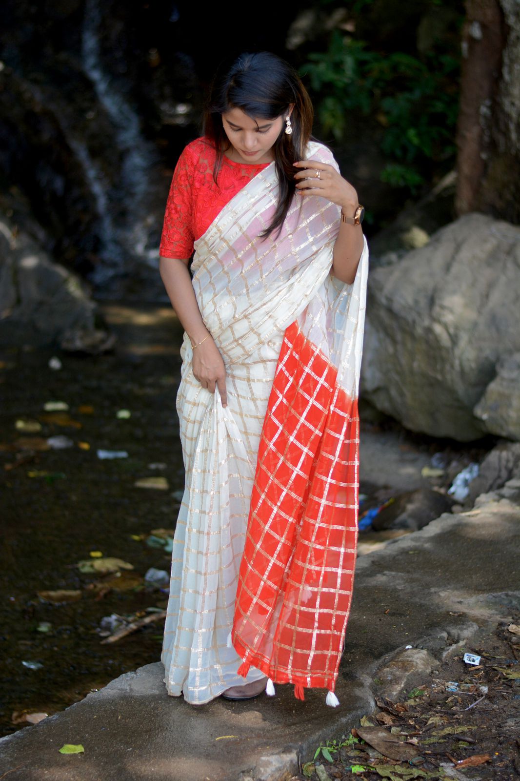 Cream chiffon saree with red thread embroidery blouse