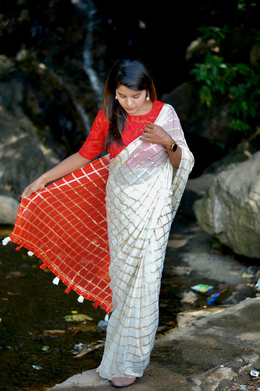 Cream chiffon saree with red thread embroidery blouse