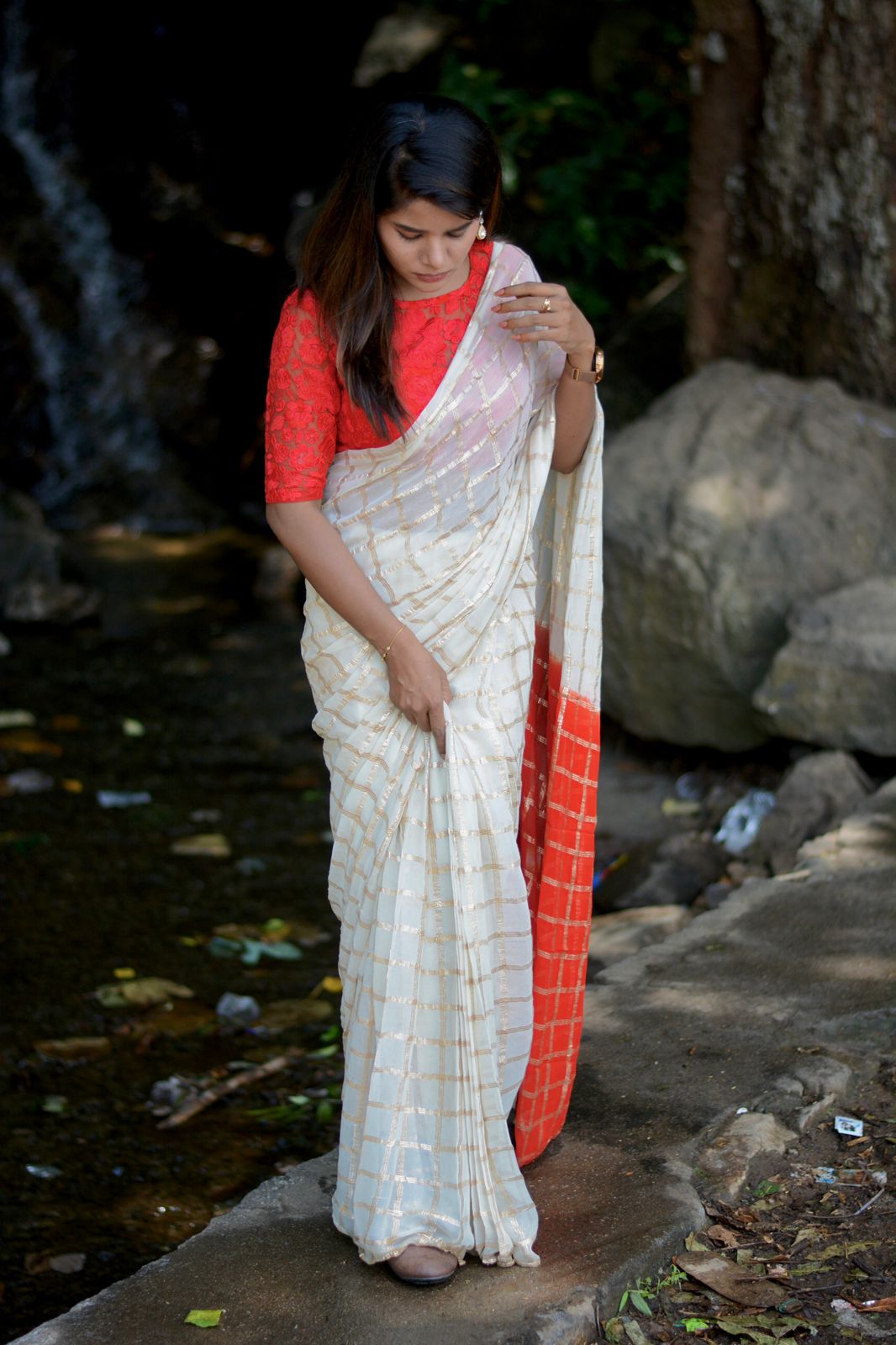 Cream chiffon saree with red thread embroidery blouse