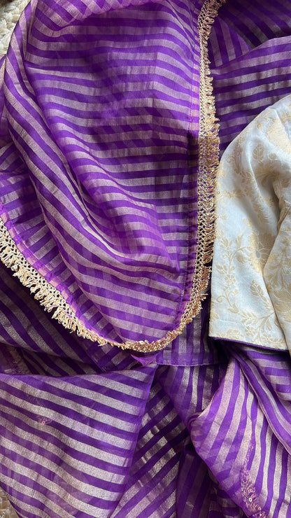 Purple stripped tissue saree with cream silk banarasi blouse