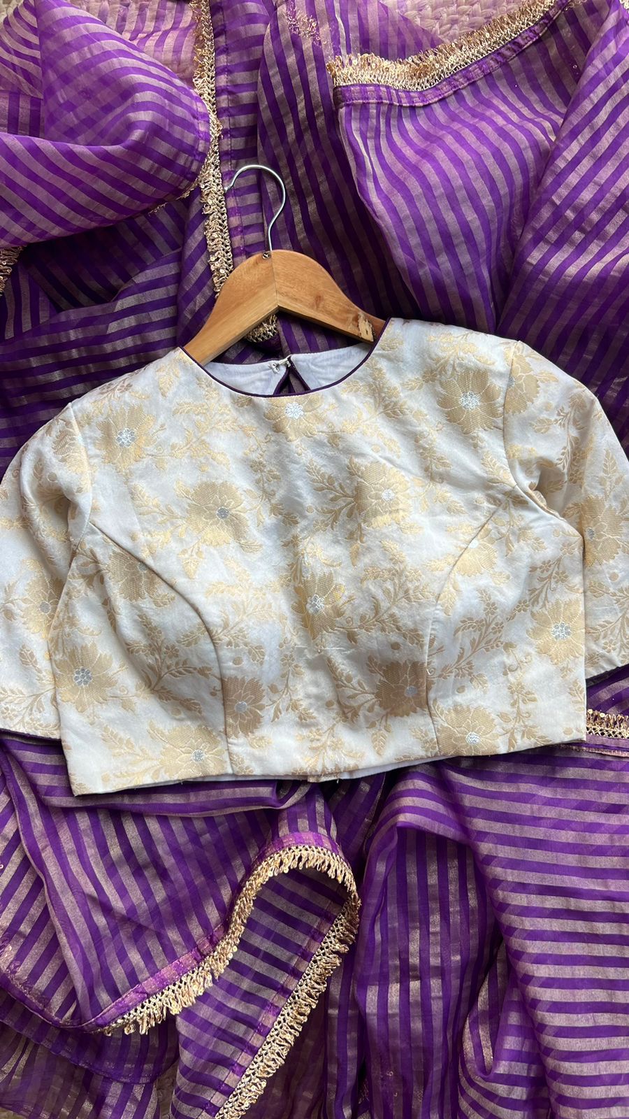 Purple stripped tissue saree with cream silk banarasi blouse