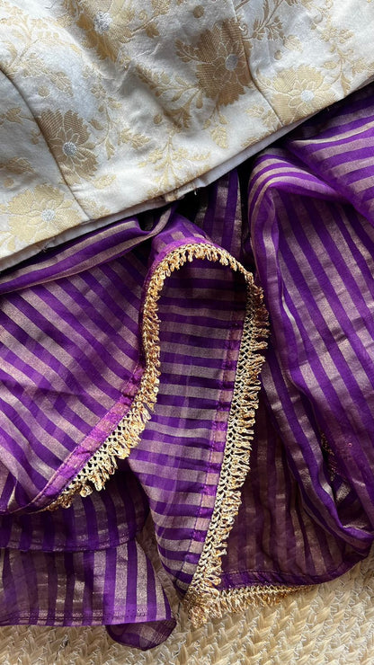 Purple stripped tissue saree with cream silk banarasi blouse