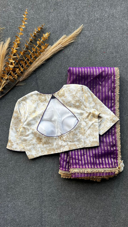 Purple stripped tissue saree with cream silk banarasi blouse